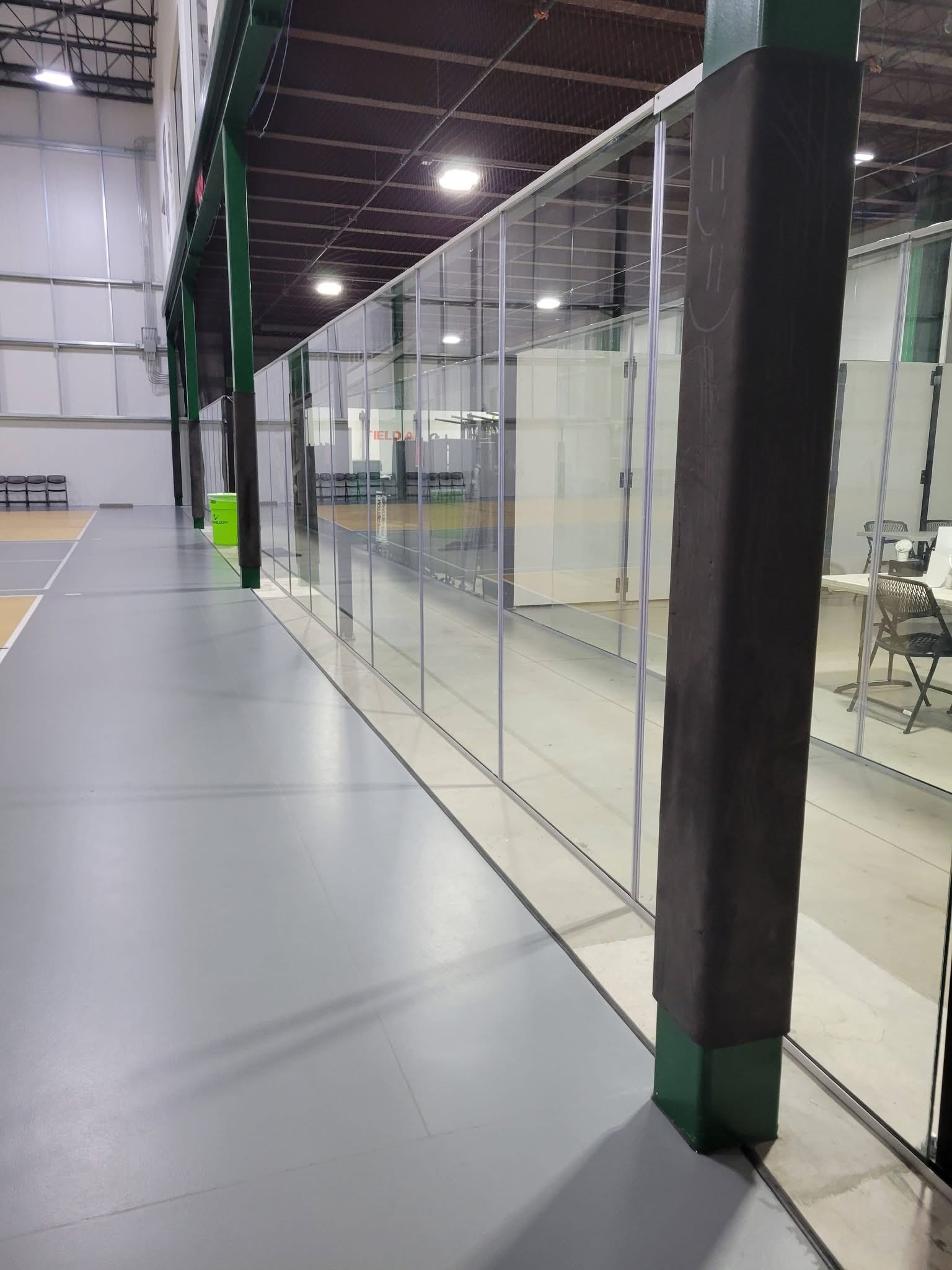 Clean commercial glass corridor and tiled floor